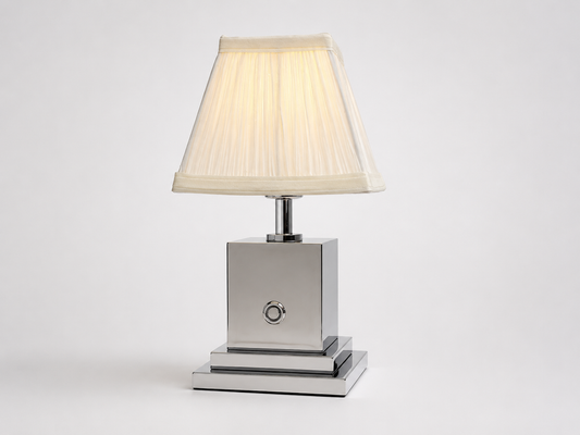 Chrome rechargeable table lamp with ivory pleated shade