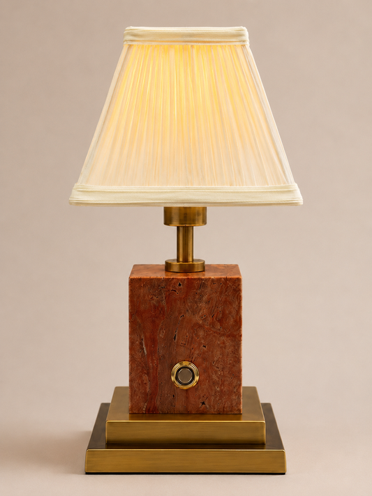 Red stone and brushed brass rechargeable lamp with ivory pleated shade