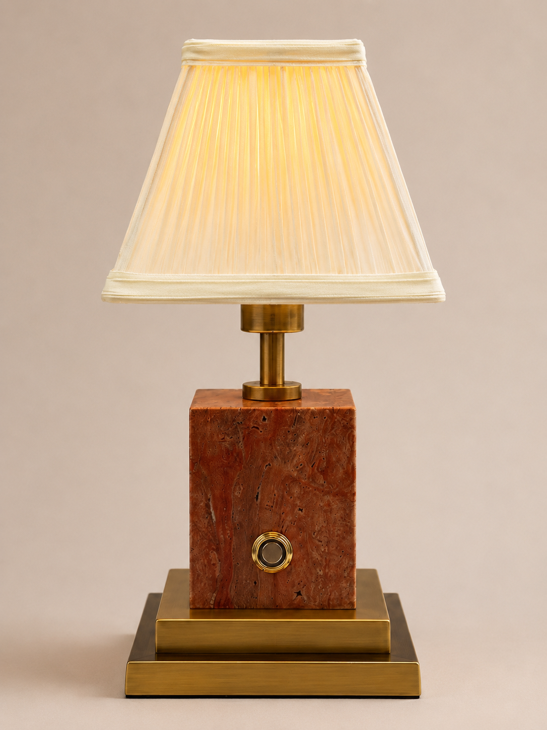 Red stone and brushed brass rechargeable lamp with ivory pleated shade