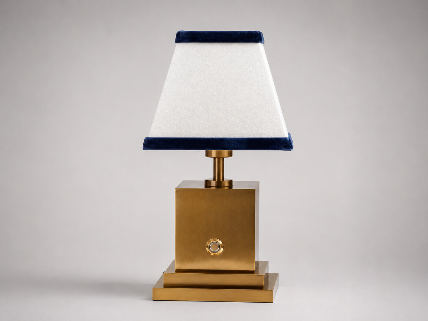 Brushed brass rechargeable table lamp with white linen and navy blue velvet shade