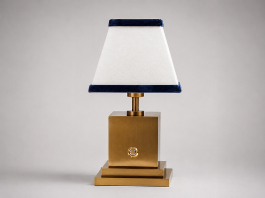 Brushed brass rechargeable table lamp with white linen and navy blue velvet shade